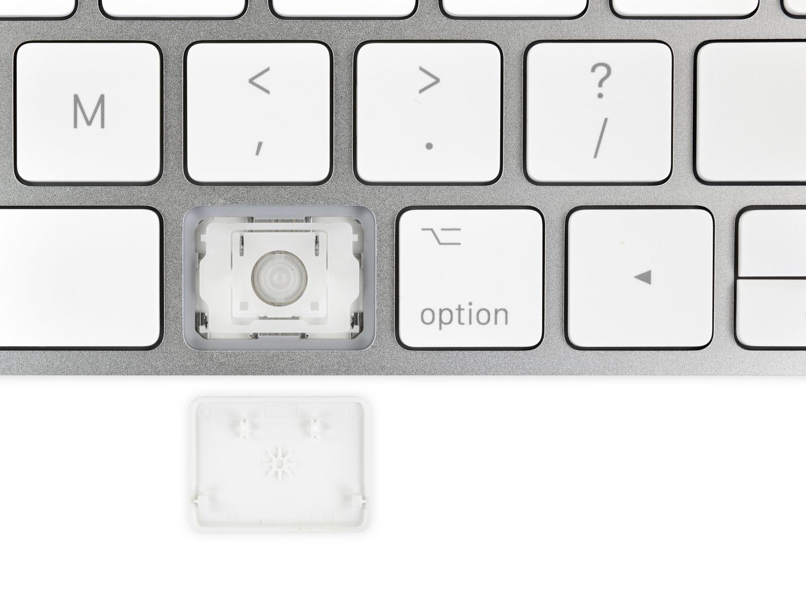 Apple Lab engineer servicing a MacBook at the workbench